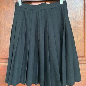 Black wool crepe above the knee pleated mini skirt